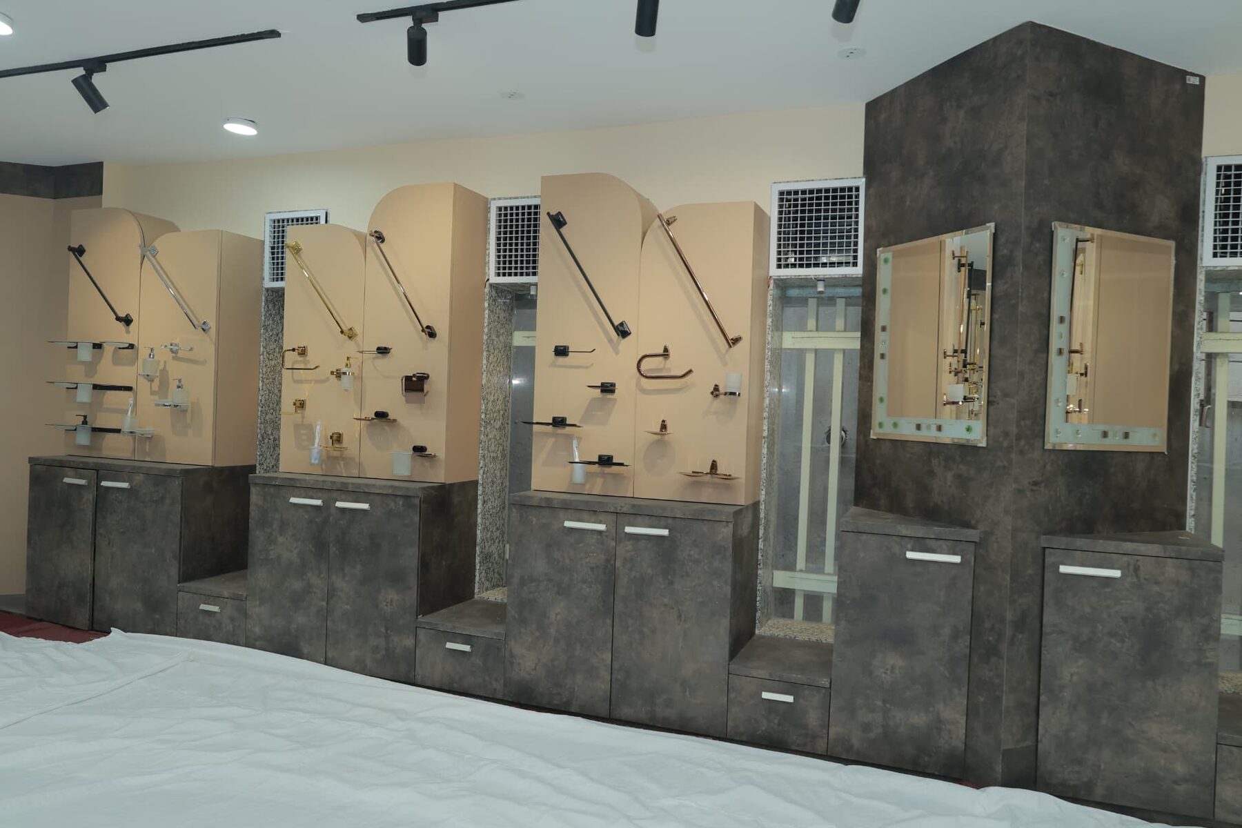 Extended bath-accessory display with cabinets and framed mirrors